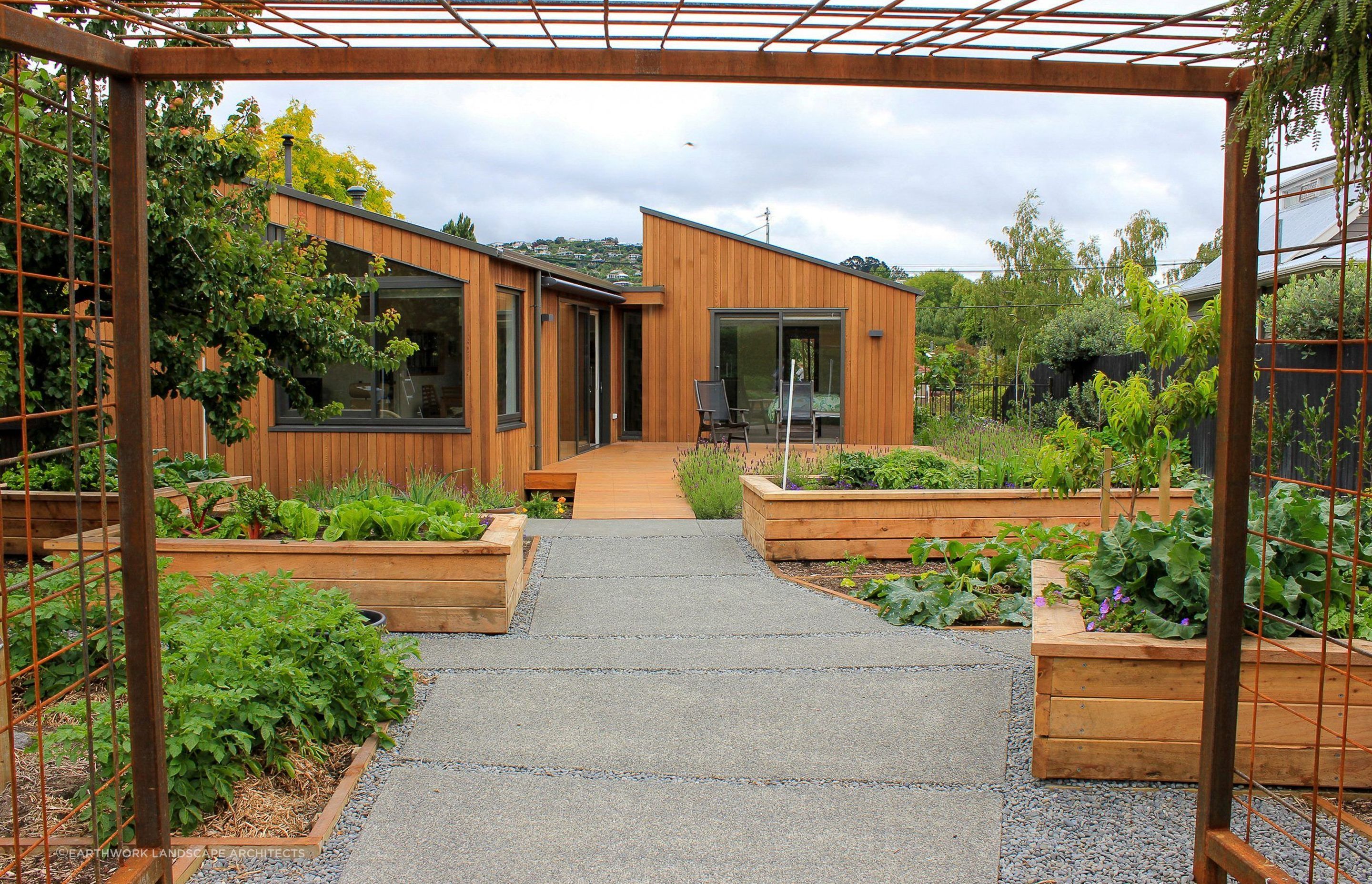A productive garden that is easily accessed from this Opawa home thanks to thoughtfully designed deck and paving.