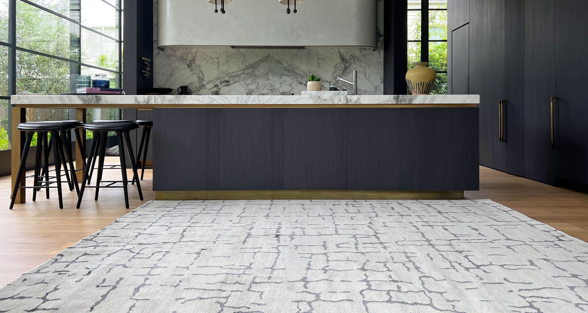 Orbelo Shale features a silk motif in gunmetal hues over a neutral wool base.
