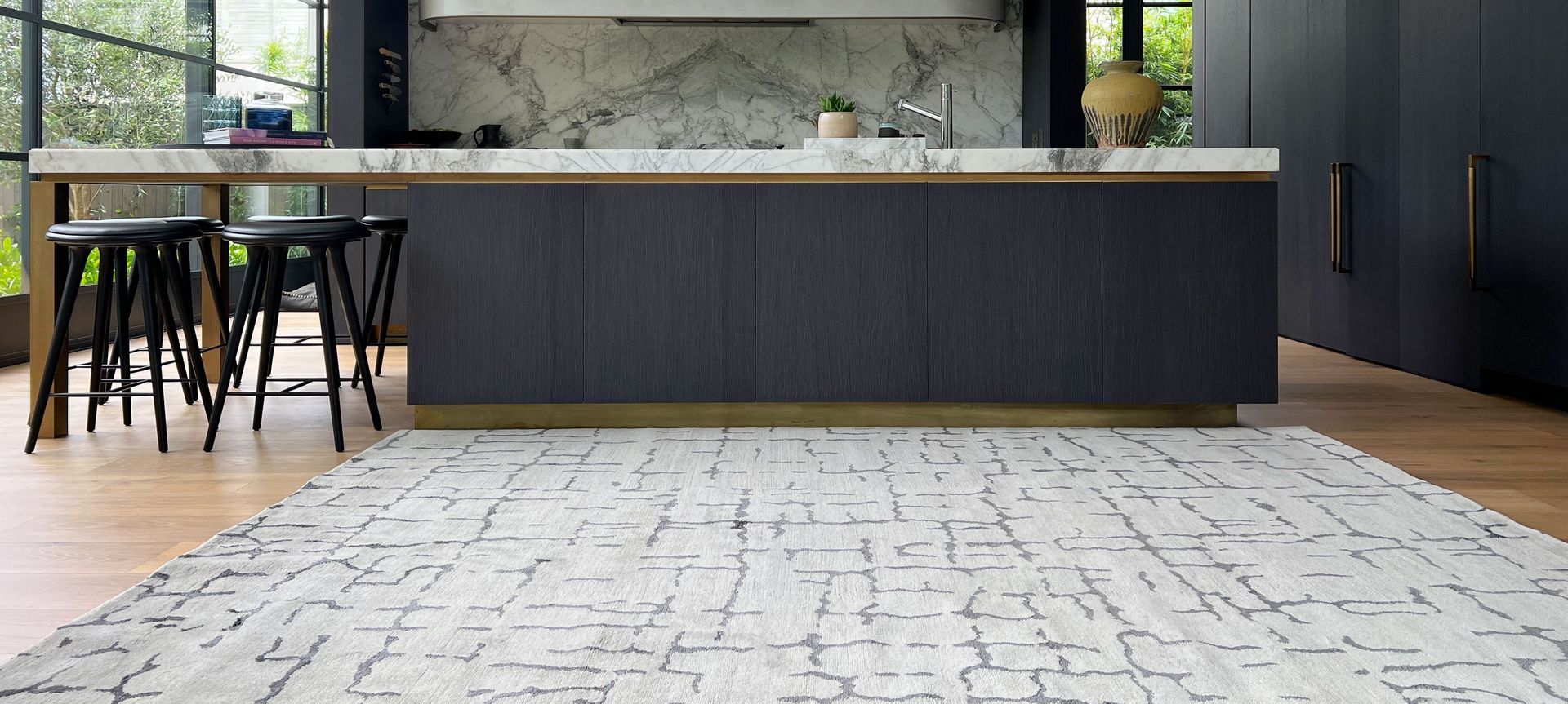 Orbelo Shale features a silk motif in gunmetal hues over a neutral wool base.