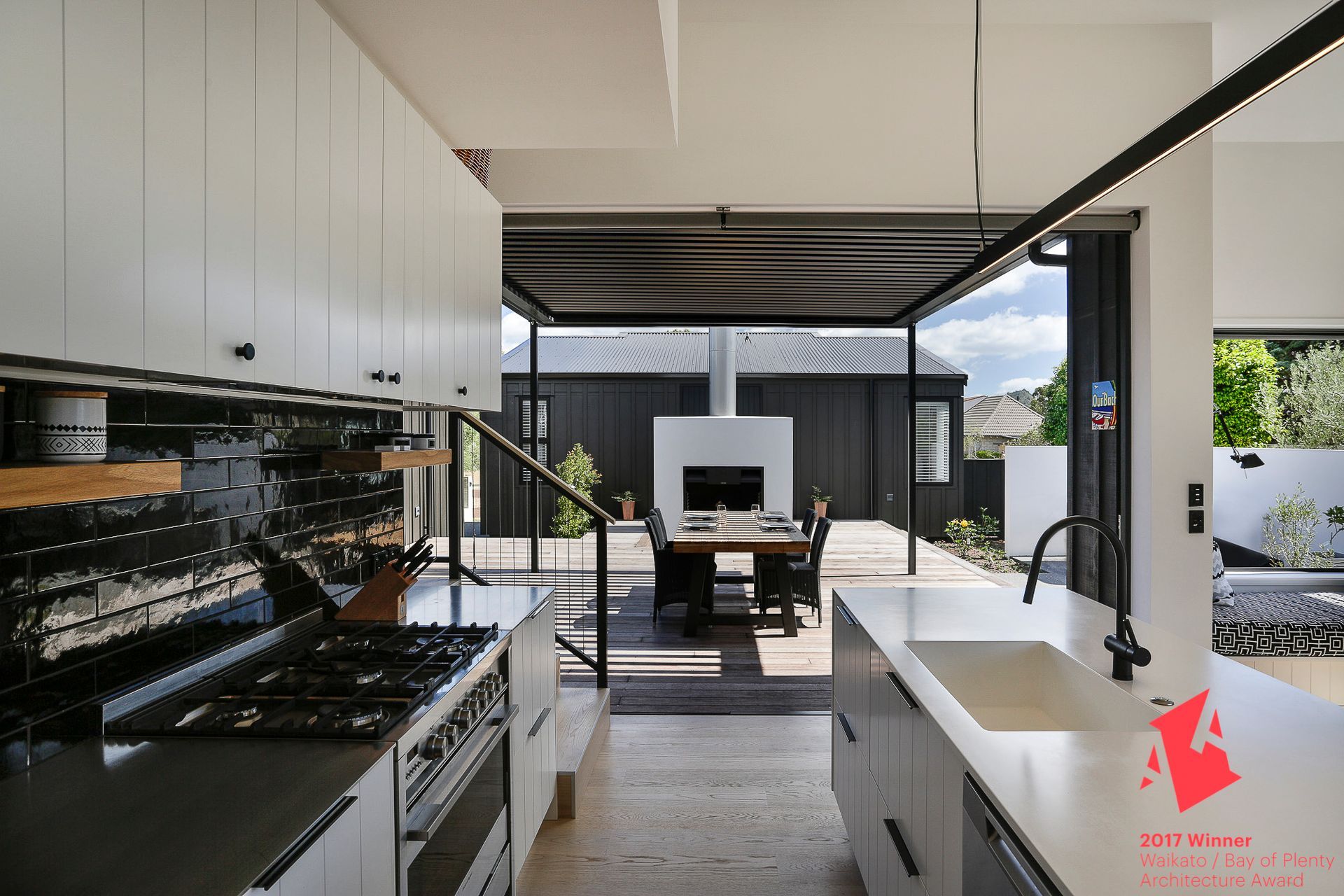 The addition of a louvre roof maximises indoor-outdoor flow from the kitchen and creates a welcoming outdoor space.