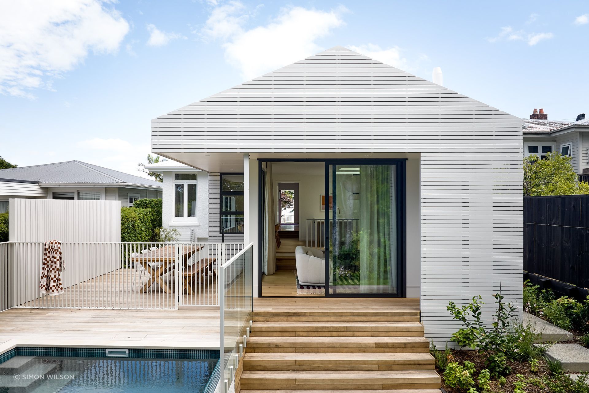 At Pop-Up Book, a stepped floor level, taller openings and overhead skylights bring greater volume and natural light to the south-facing living spaces.