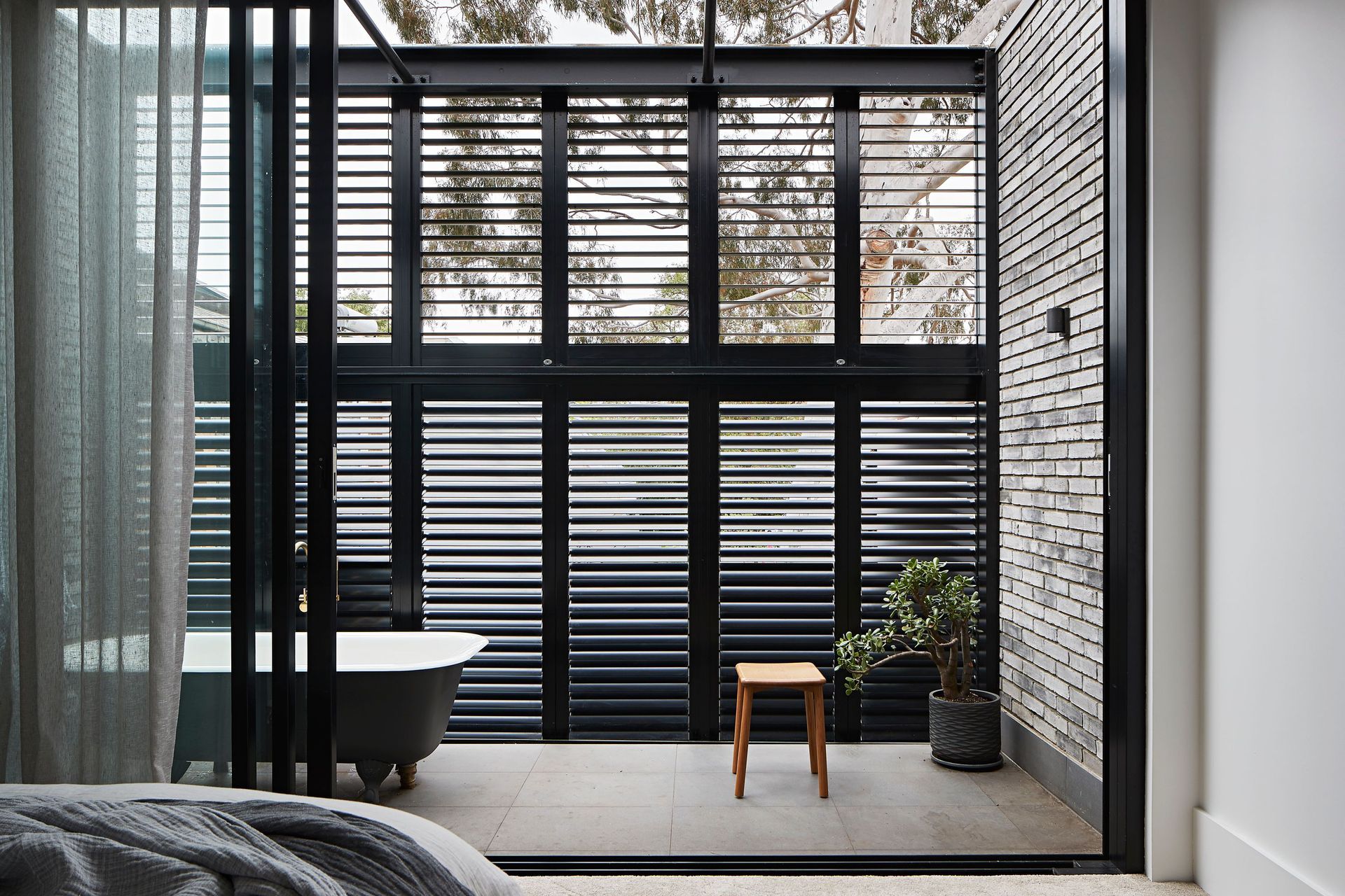 An outdoor bath gets natural light and plenty of fresh air. South Melbourne Terrace by Studio Tom | Photography by Shannon McGrath