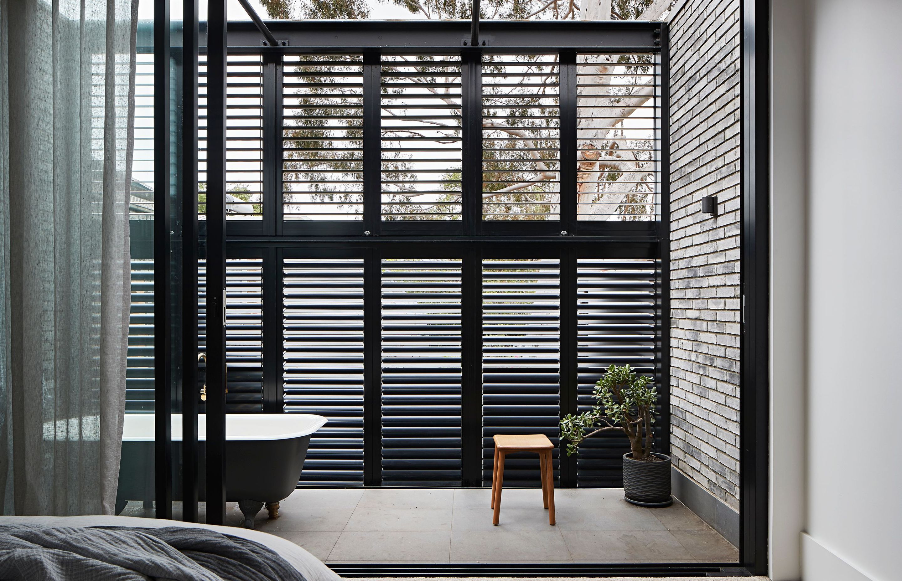 An outdoor bath gets natural light and plenty of fresh air. South Melbourne Terrace by Studio Tom | Photography by Shannon McGrath