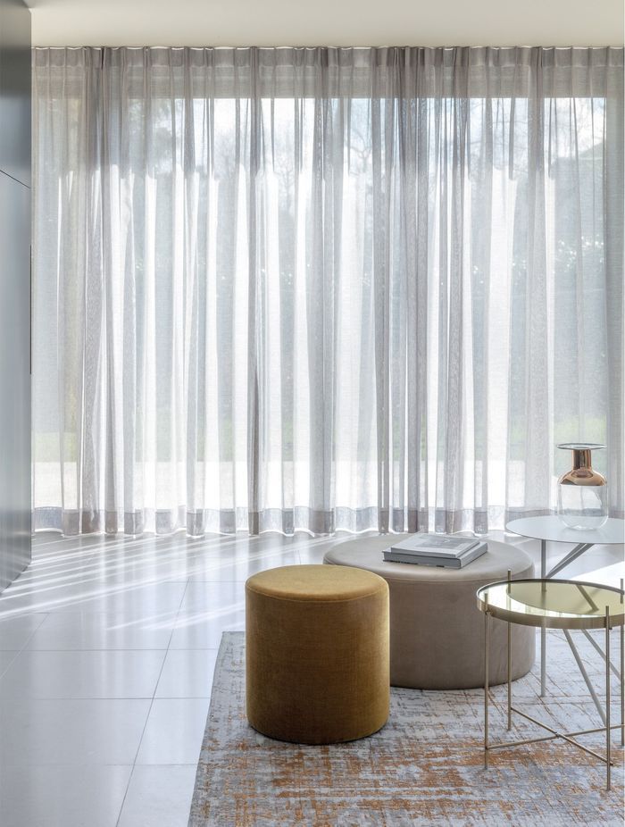 Custom made unlined sheer curtains elegantly enhance any space.