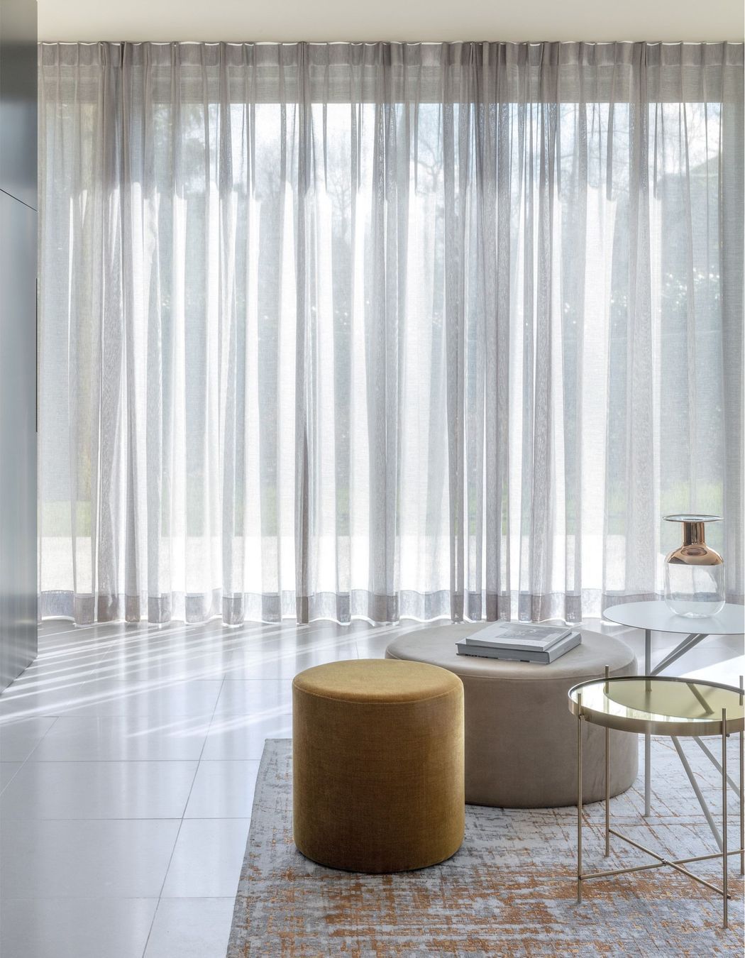 Custom made unlined sheer curtains elegantly enhance any space.