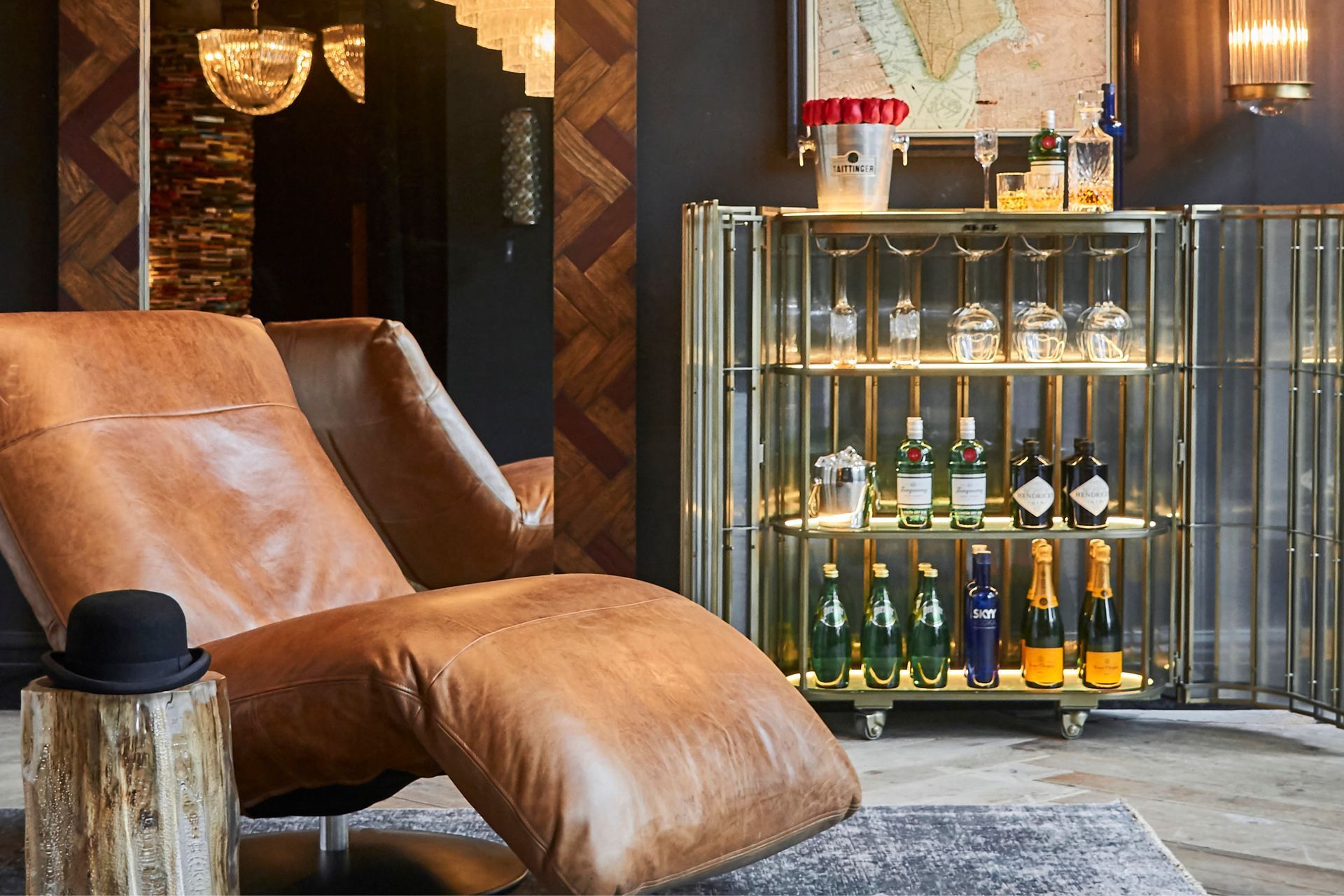 A bar cart is a fantastic furnishing that adds to an occasion, seen here with the Shimmer Bar Cabinet by Timothy Oulton