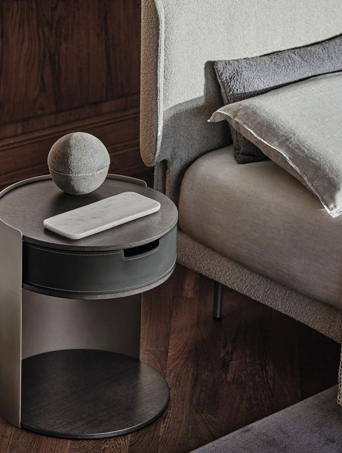Metal bedside tables, like this Skin Side Table, offer a blend of style and functionality.