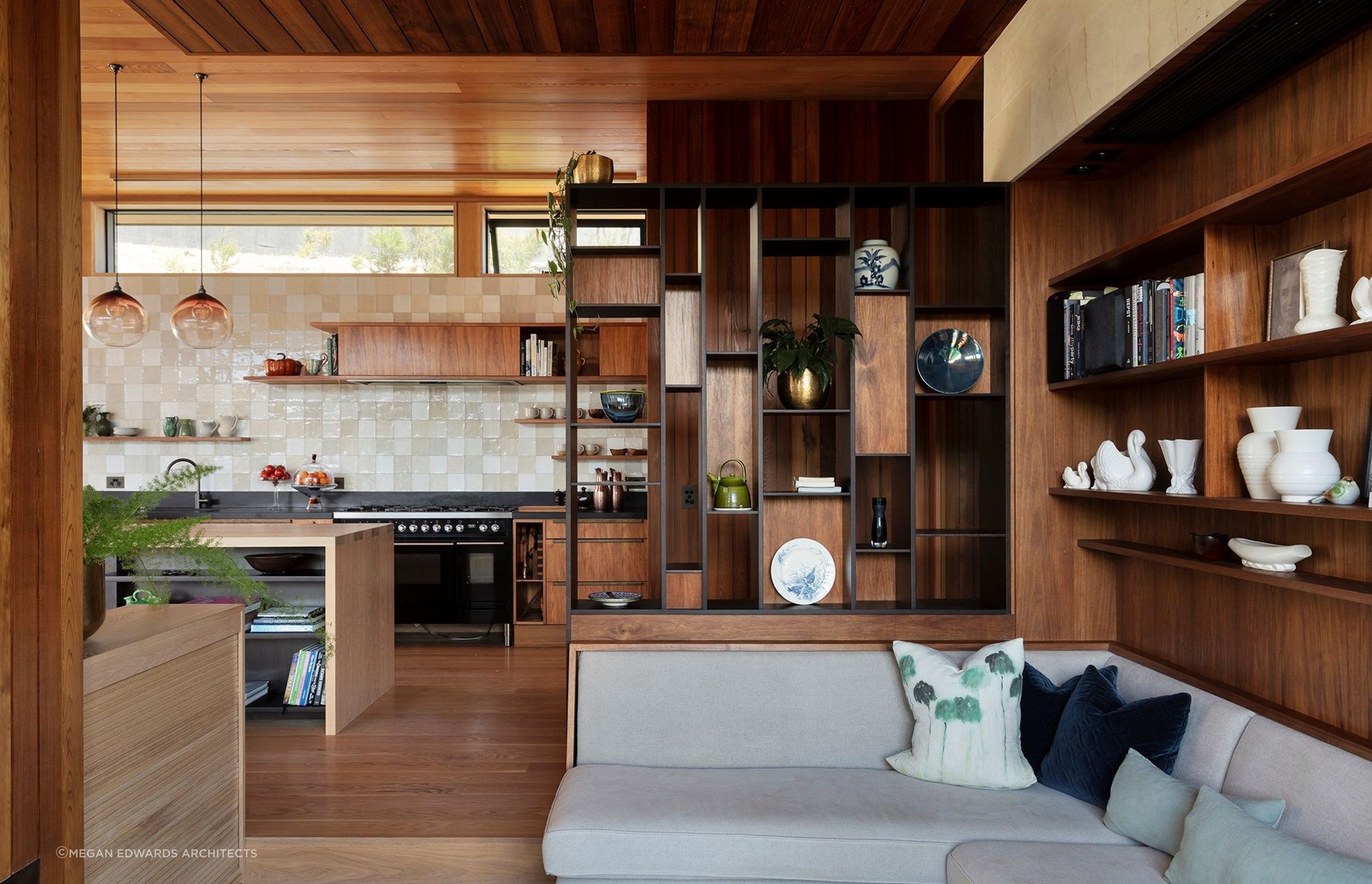 Natural materials like wood and geometric shapes are key features of Mid-century modern design style, beautifully expressed in this home in Greenhithe. | Photography: Sam Hartnett