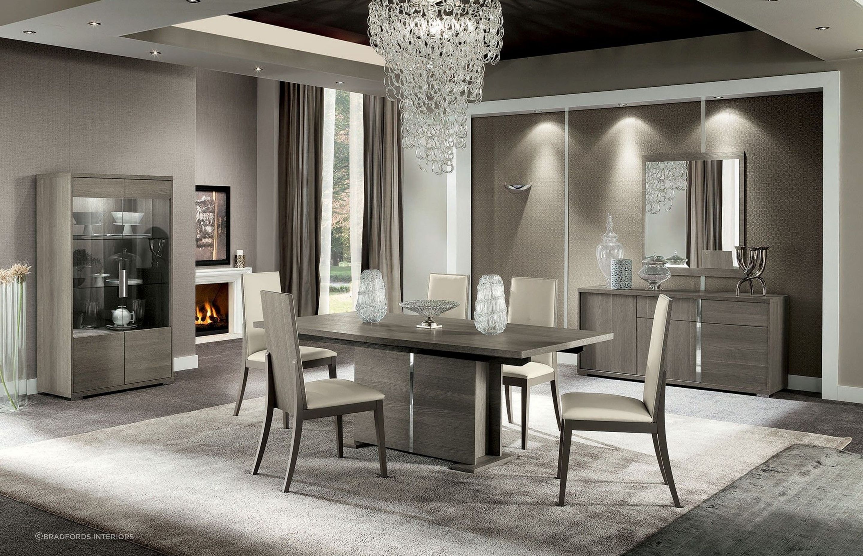 A floor rug can provide comfort, warmth and help define a dining space, seen here with the elegant Tivoli Dining Table by Alf Italia.