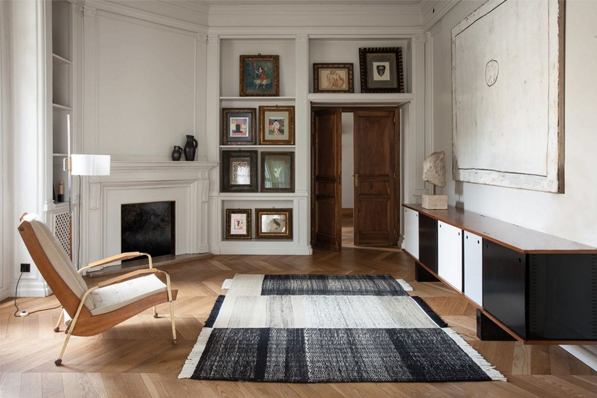 The Tres Rug by Nanimarquina is a traditional Indian flat-weave Dhurrie rug creates and incredibly personal feeling in this space