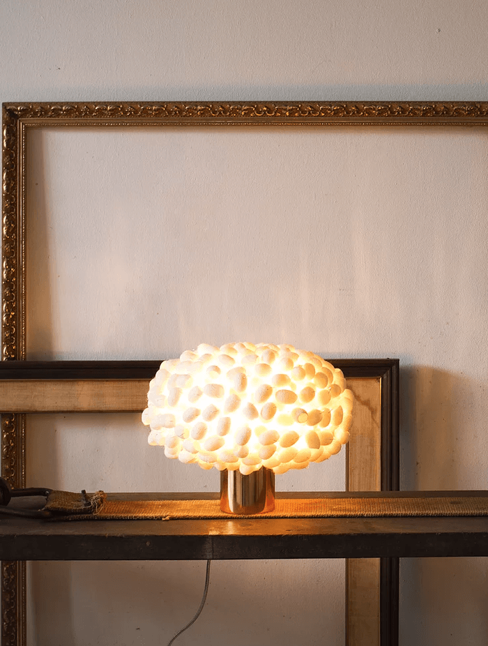 The delicately beautiful individual silk cocoons of the Unit Table C Table Lamp by Ango is a wonderful unique feature.