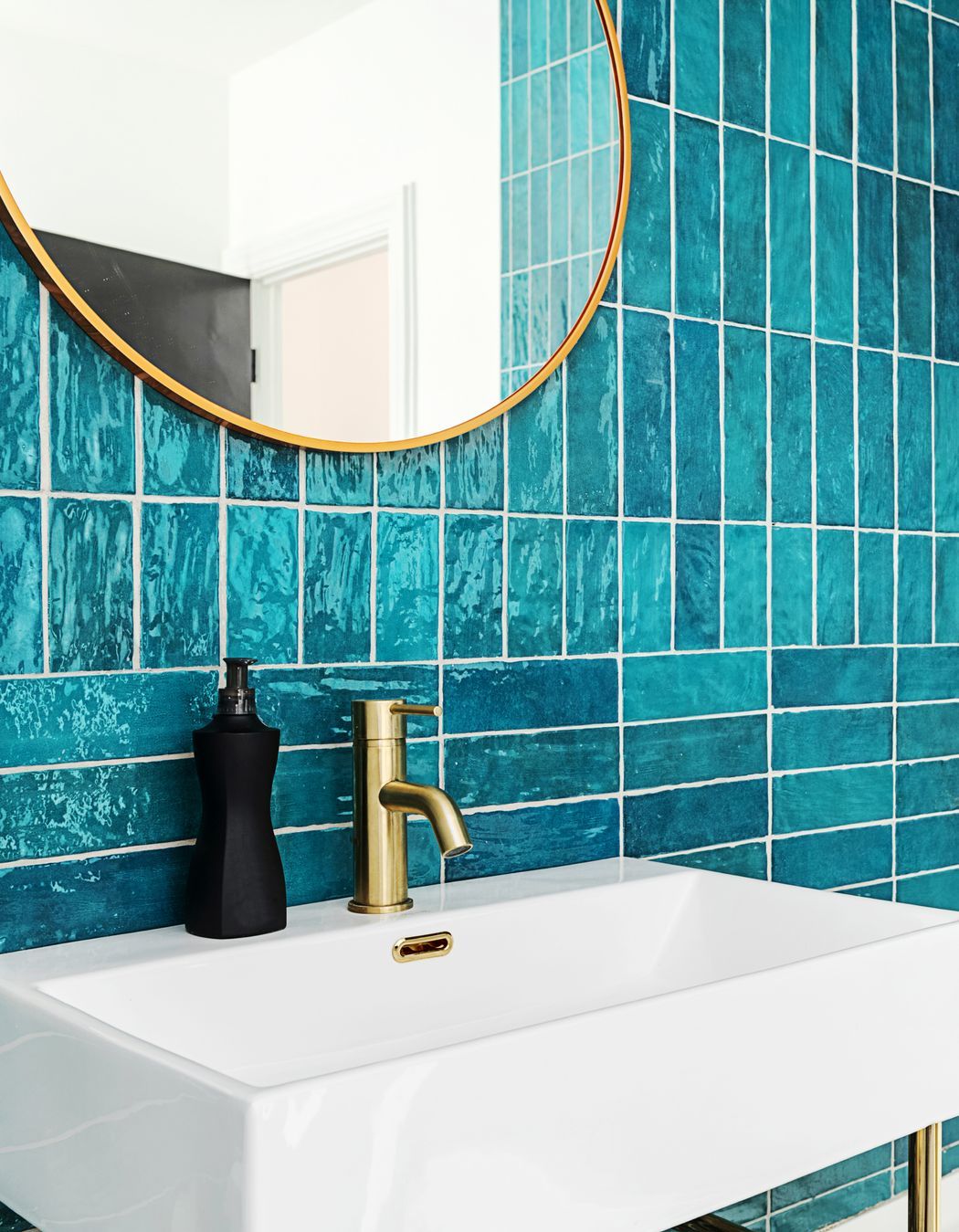 Select compact fixtures like Voda Plumbingware's Mini Basin Mixer in Brushed Brass.