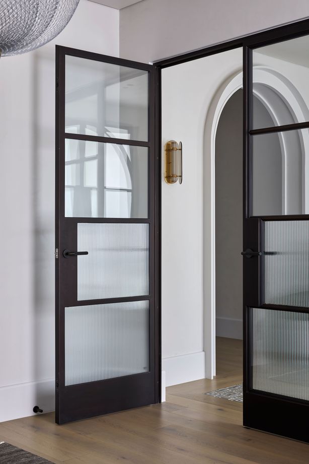 The doors incorporate reeded glass for added style and privacy.