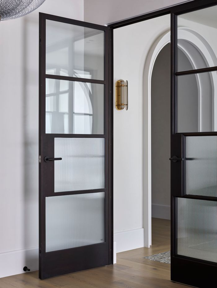 The doors incorporate reeded glass for added style and privacy.