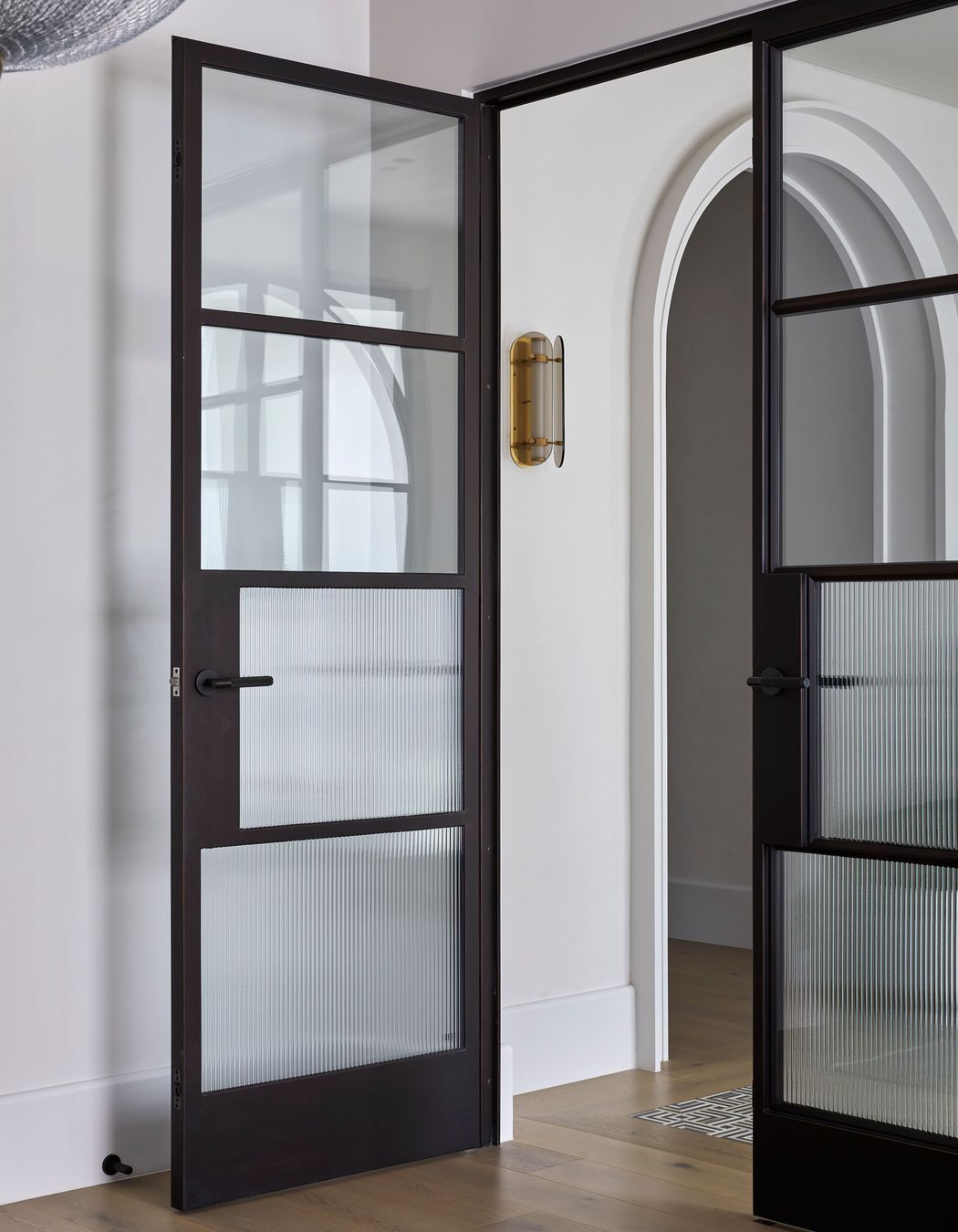 The doors incorporate reeded glass for added style and privacy.