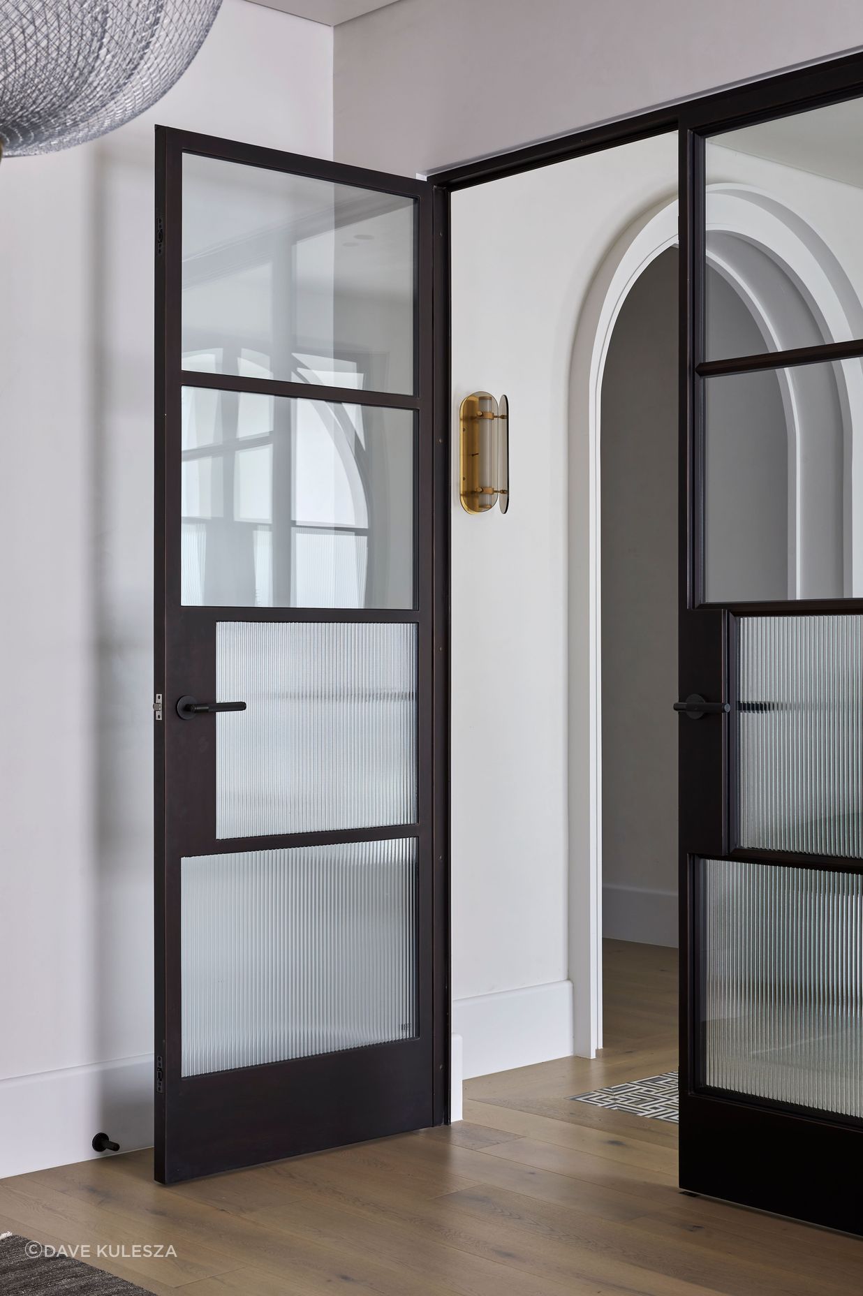 The doors incorporate reeded glass for added style and privacy.