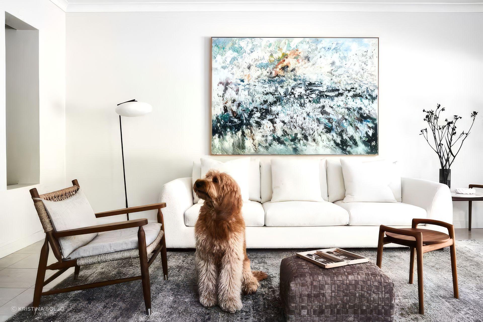 Lara’s groodle Kramer is a regular companion on Fabio’s walks to the beach. Coastal Estuary by Noosa-based artist Colin Pennock hangs above a Chloe sofa, part of the Made in Australia range which was created “to keep up Dad’s tradition of craftsmanship”, says Fabio. Flexform ‘Ascanio’ side tables, ‘Tessa’ armchair, and ‘Bangkok’ ottoman, Penta Light ‘Mami’ floor lamp, and Cloud rug, all from Fanuli.