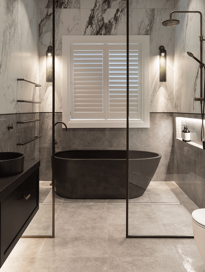 In this residential bathroom, Sticks + Stones Design used Quantum's large-format Italian Carrara 900 x 1800mm tiles from the popular Bianco collection.