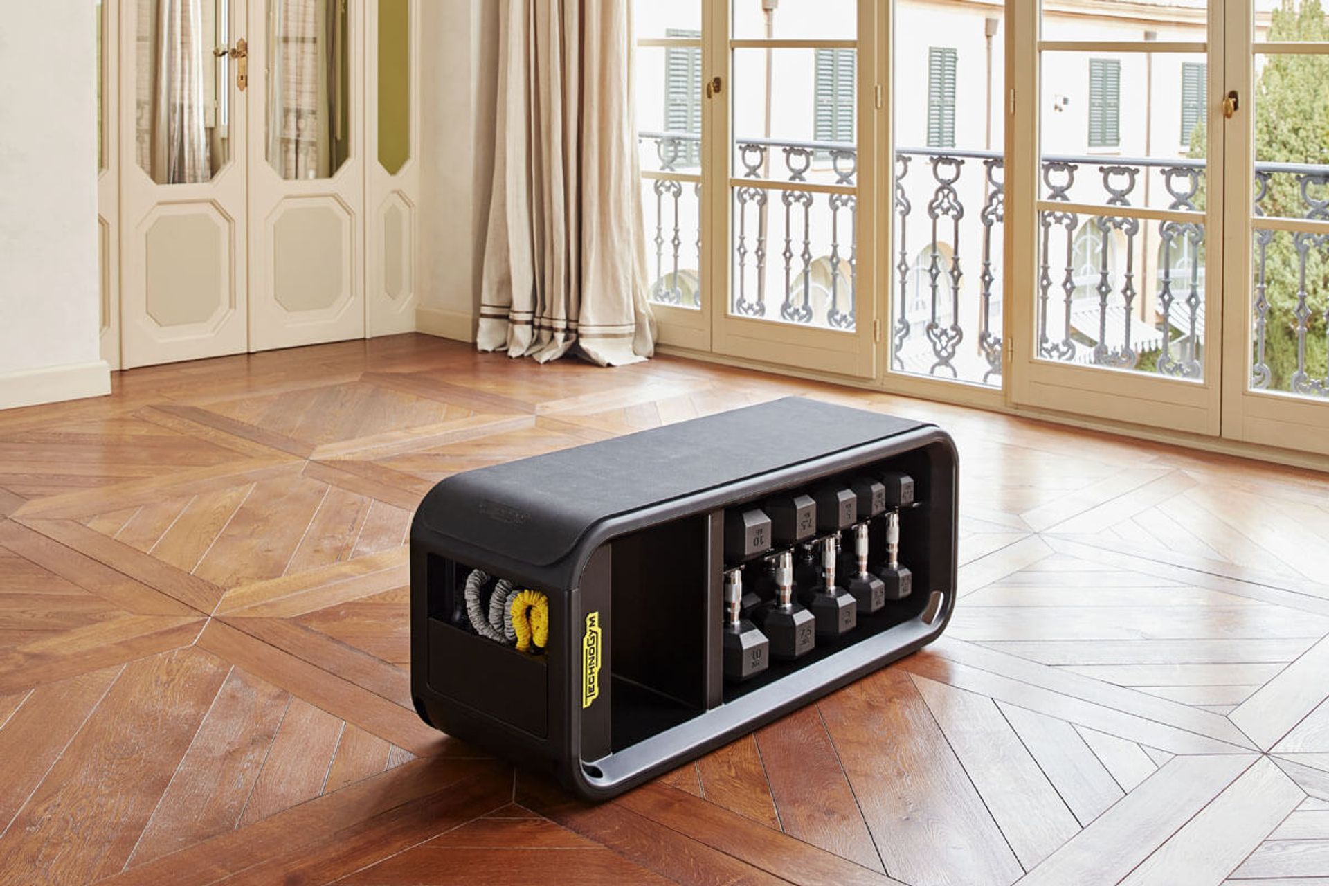 The sleek and versatile Technogym Bench with dedicated storage holds all the tools you need for a complete workout.