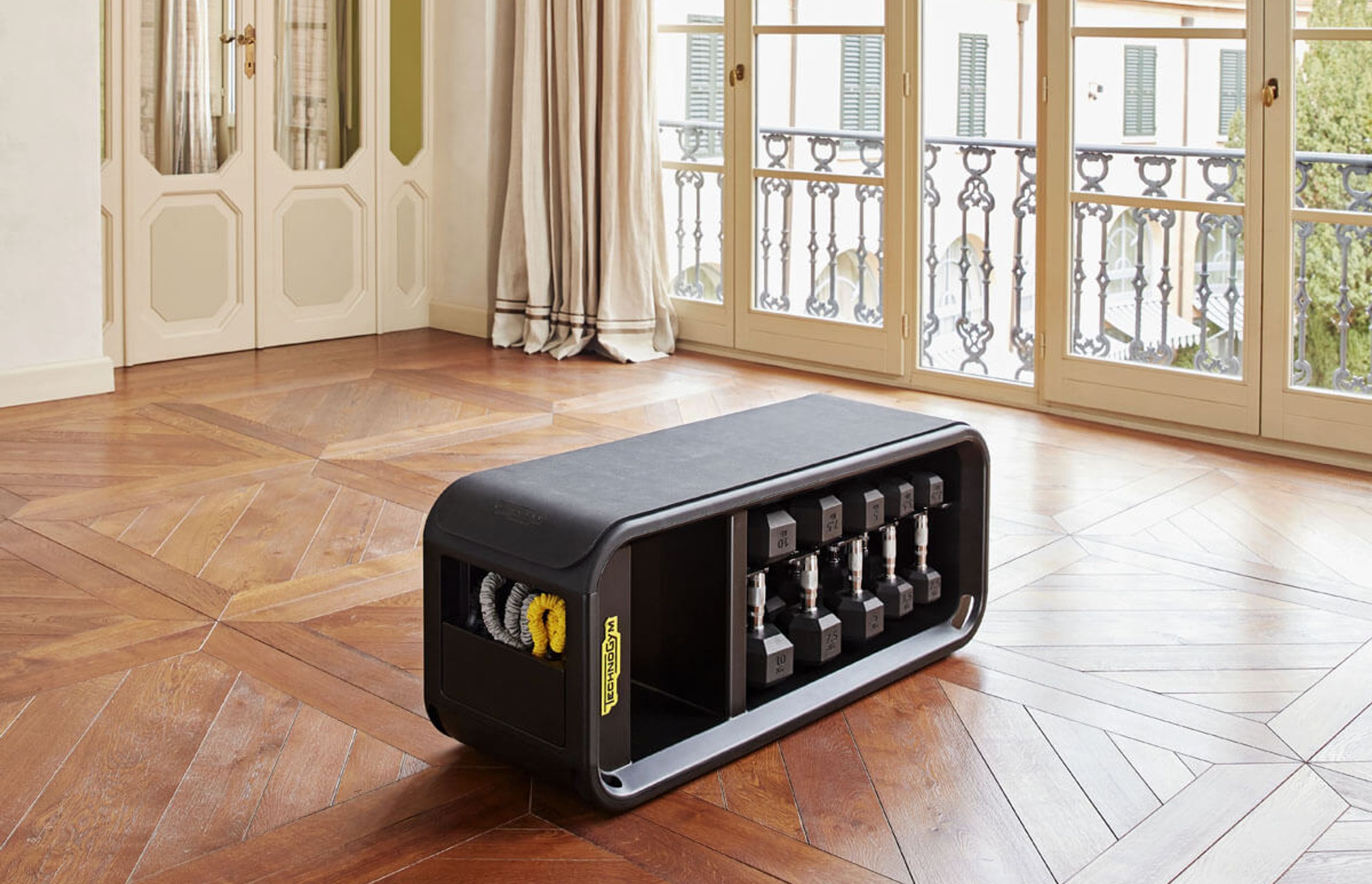 The sleek and versatile Technogym Bench with dedicated storage holds all the tools you need for a complete workout.
