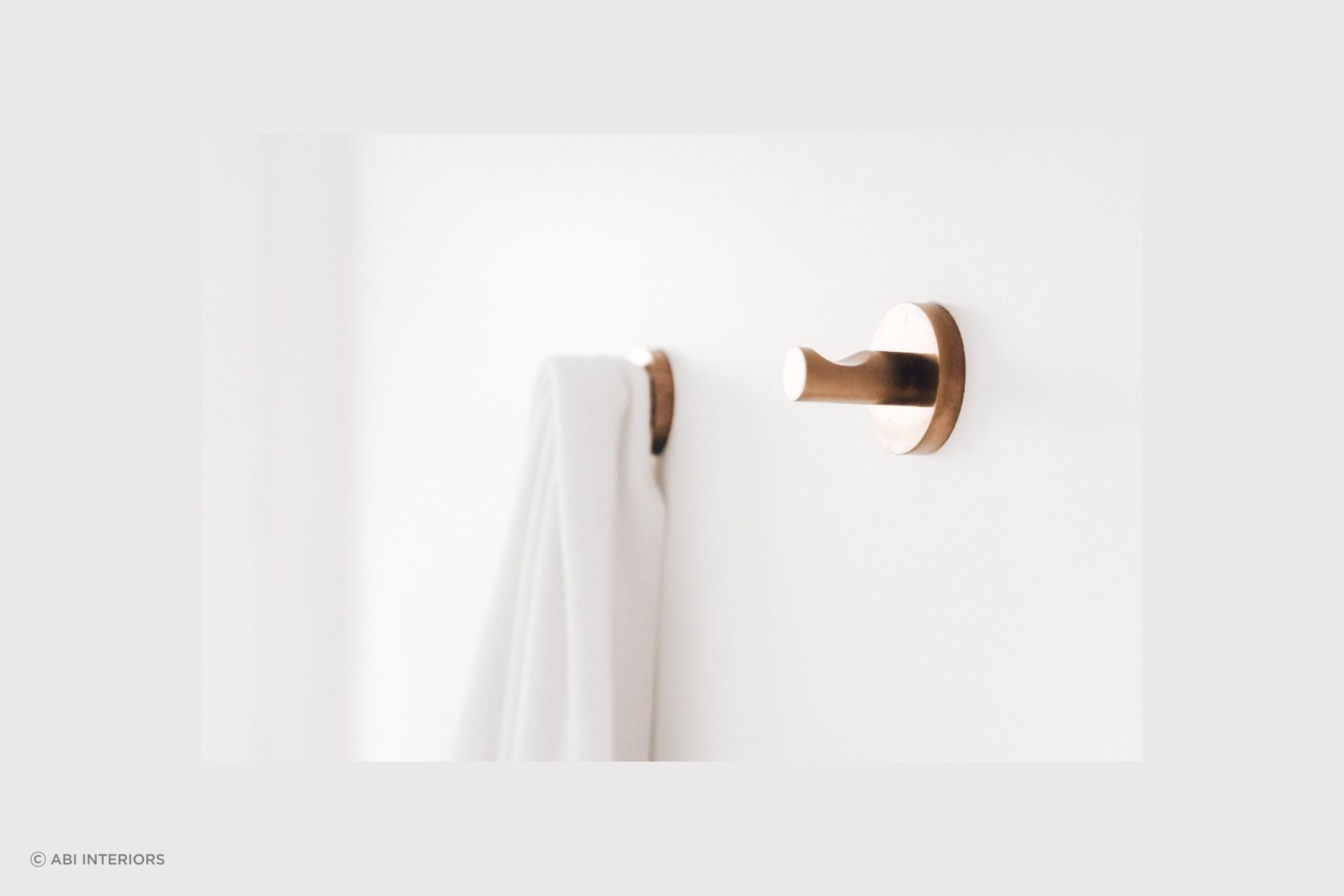 The Elysian Robe Hook in brushed copper offers a sophisticated solution for hanging your robes and towels.