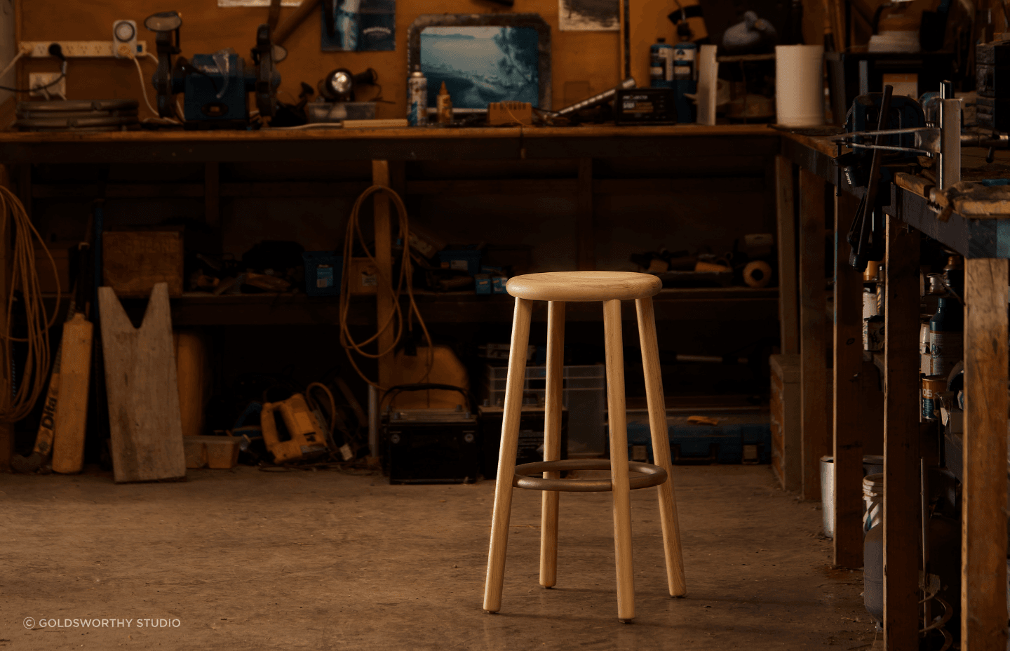 The Double Happy was designed in 2012, aiming to express the most fundamental characteristics of one of the oldest pieces of furniture: a place to sit. A bold, substantial seat for daily use. The cast bronze ring anchors four American ash legs to the wide, contoured seat.