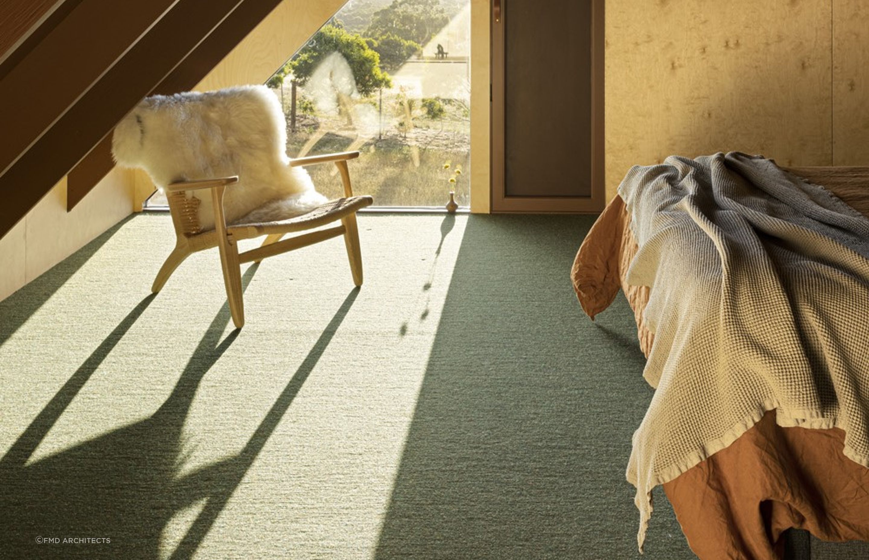 Sheepskin rugs are incredibly versatile as shown here in this Coopworth property on Bruny Island in Tasmania - Photography: Dianna Snape