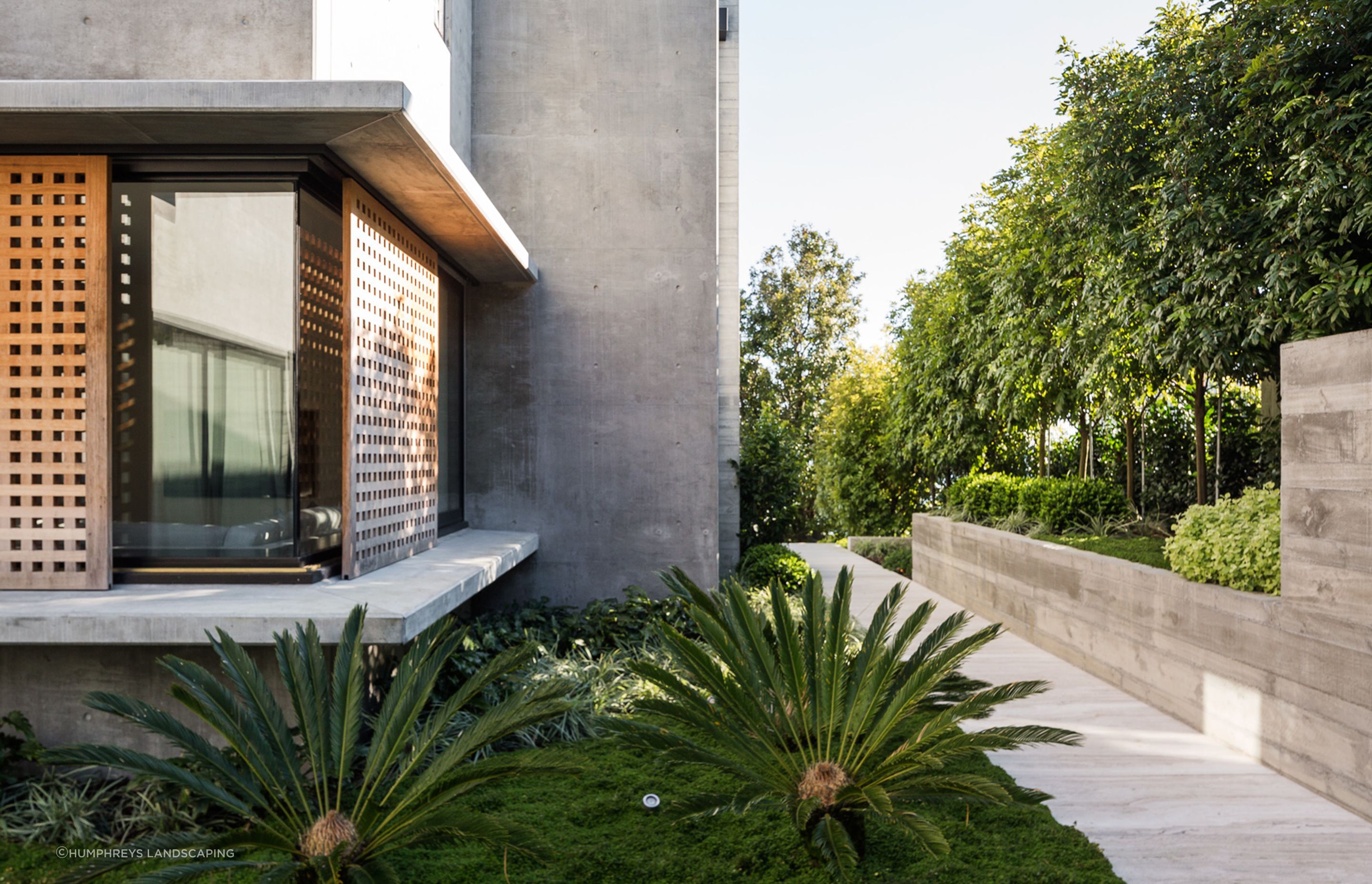 A bold contrast of building and landscaping materials has a striking impact on one and all.
