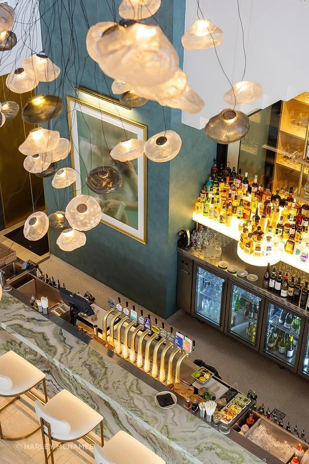 The largest Bocci commission in Australia to date, the cluster of 61 hand-blown Bocci 73 Series glass lights transform the Blowfish Ocean Grill + Bar on the Gold Coast designed by Space Cubed Design Studio. Photography by Harley McNamee courtesy of Bocci