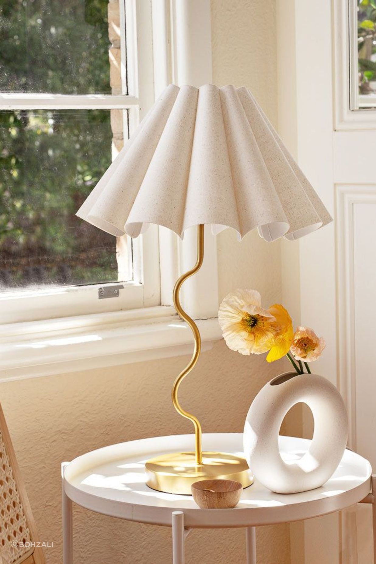The stunning Paolo &amp; Joy Cora Table Lamp with its vintage-inspired fluted lampshade and brass-plated squiggly base