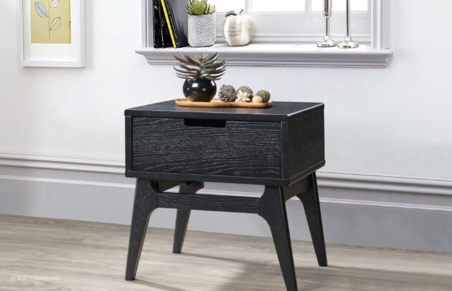Hardwood side tables, such as this Paris Hardwood Bedside Table, are popular due to their durability and sturdiness.