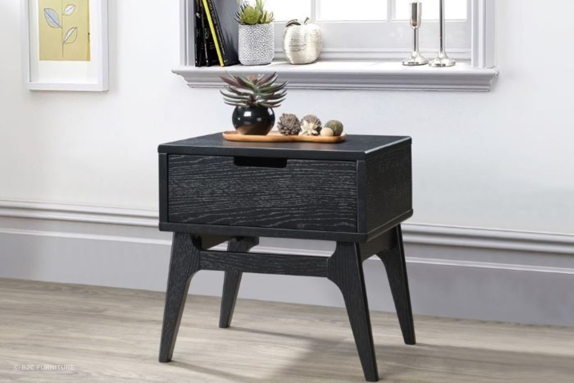 Hardwood side tables, such as this Paris Hardwood Bedside Table, are popular due to their durability and sturdiness.