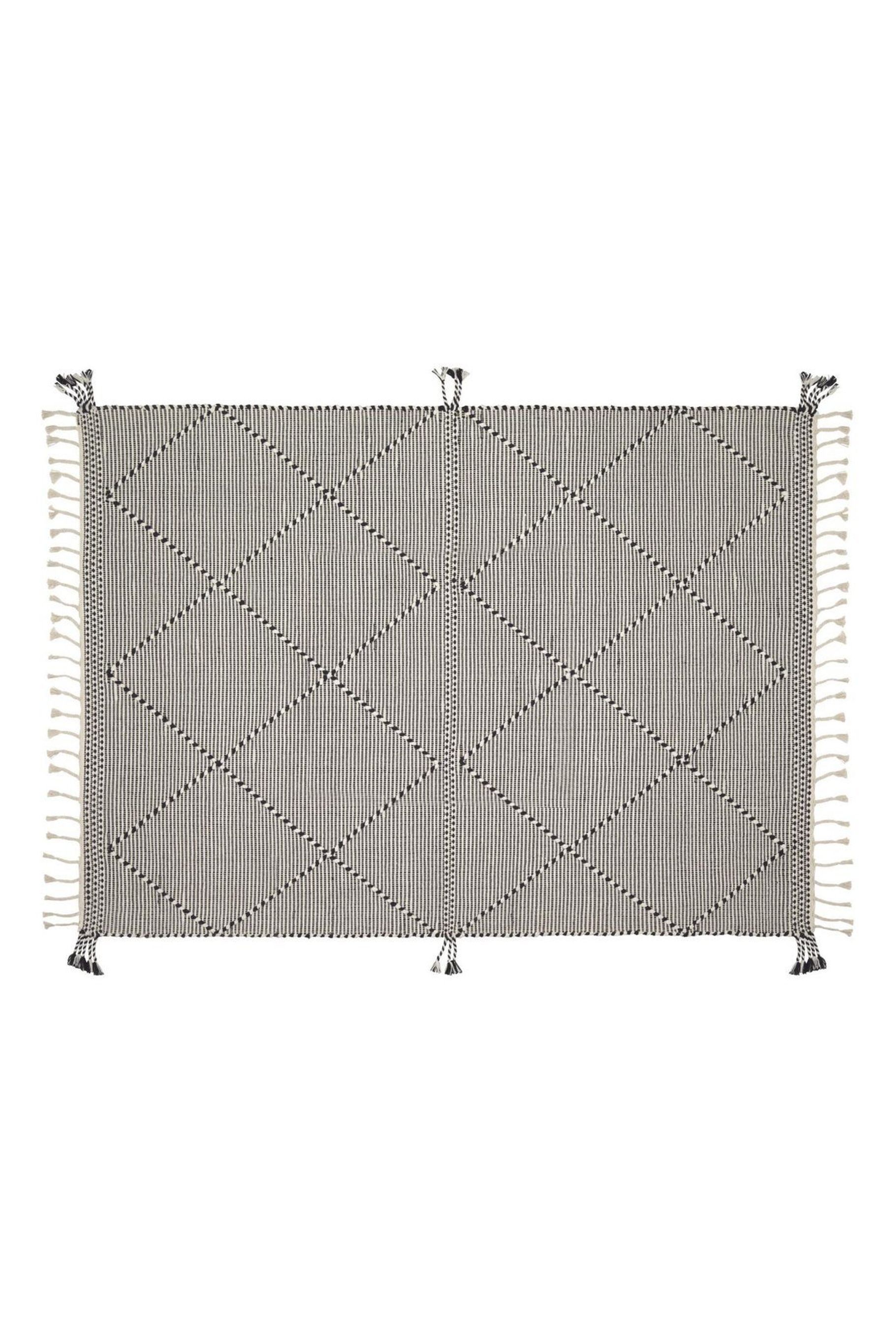 Nurit rug in black by Kave Home