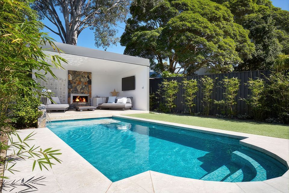 A swimming pool also doubles as a great water feature for an outdoor space. | Featured Project: Alder Ave by TSD Group.