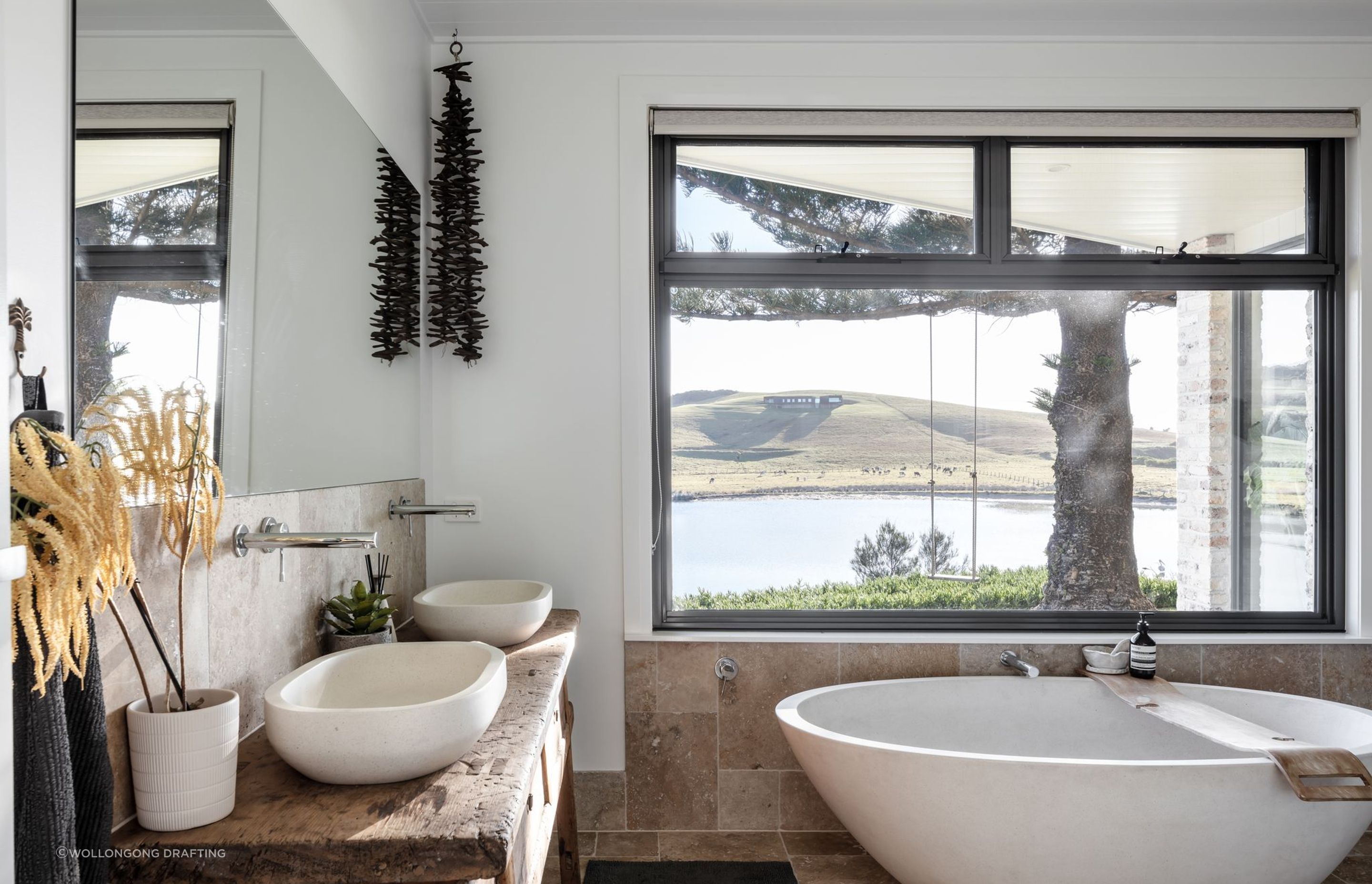 This beautiful bathroom in Werri Beach does a fine job of showcasing natural materials