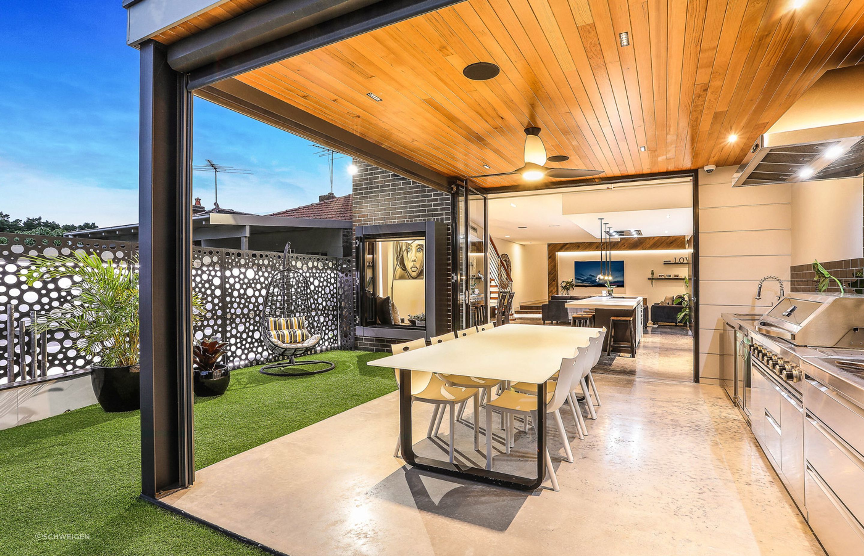 An attractive ceiling fan light at a modern family home in Sydney designed by Adrian Tarrant