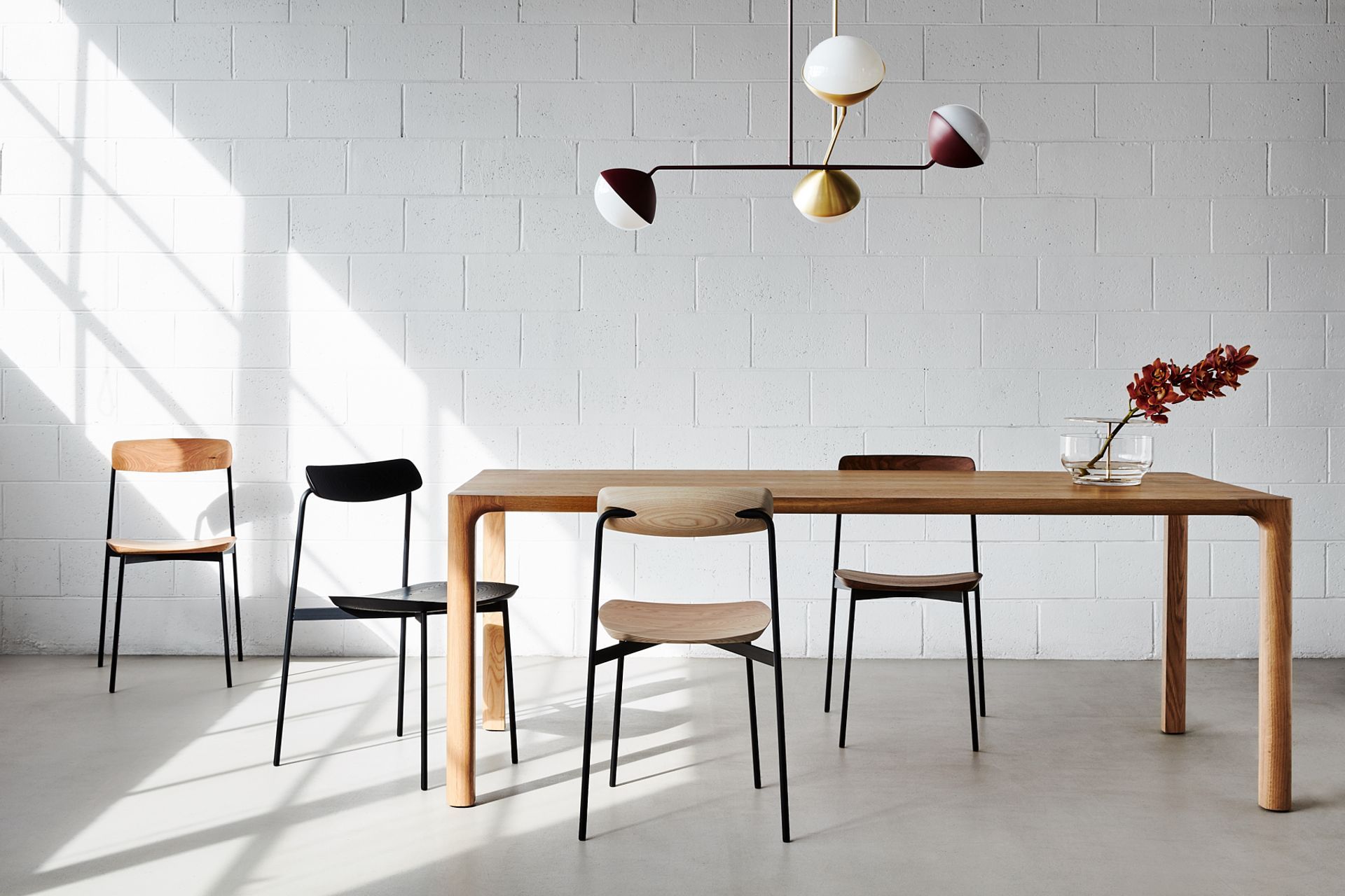You can go with a number of pendant lights or a multi-pendant light like the Jolly Pendant by NAU