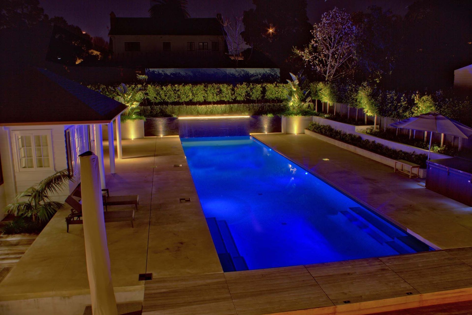 Coloured lighting can make a pool glow with stylish energy.