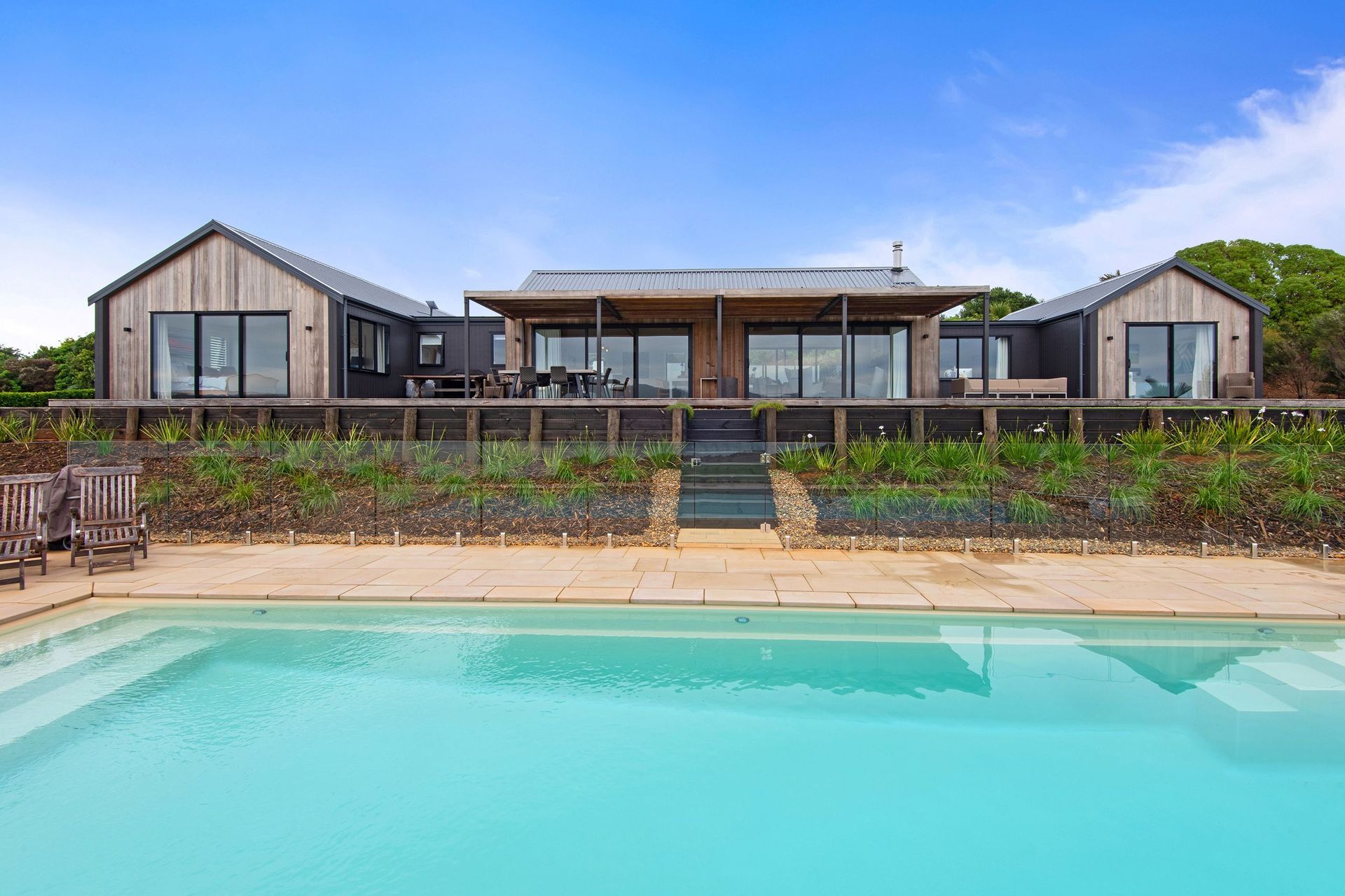 The white swimming pool turns a surprisingly vibrant turquoise when full.