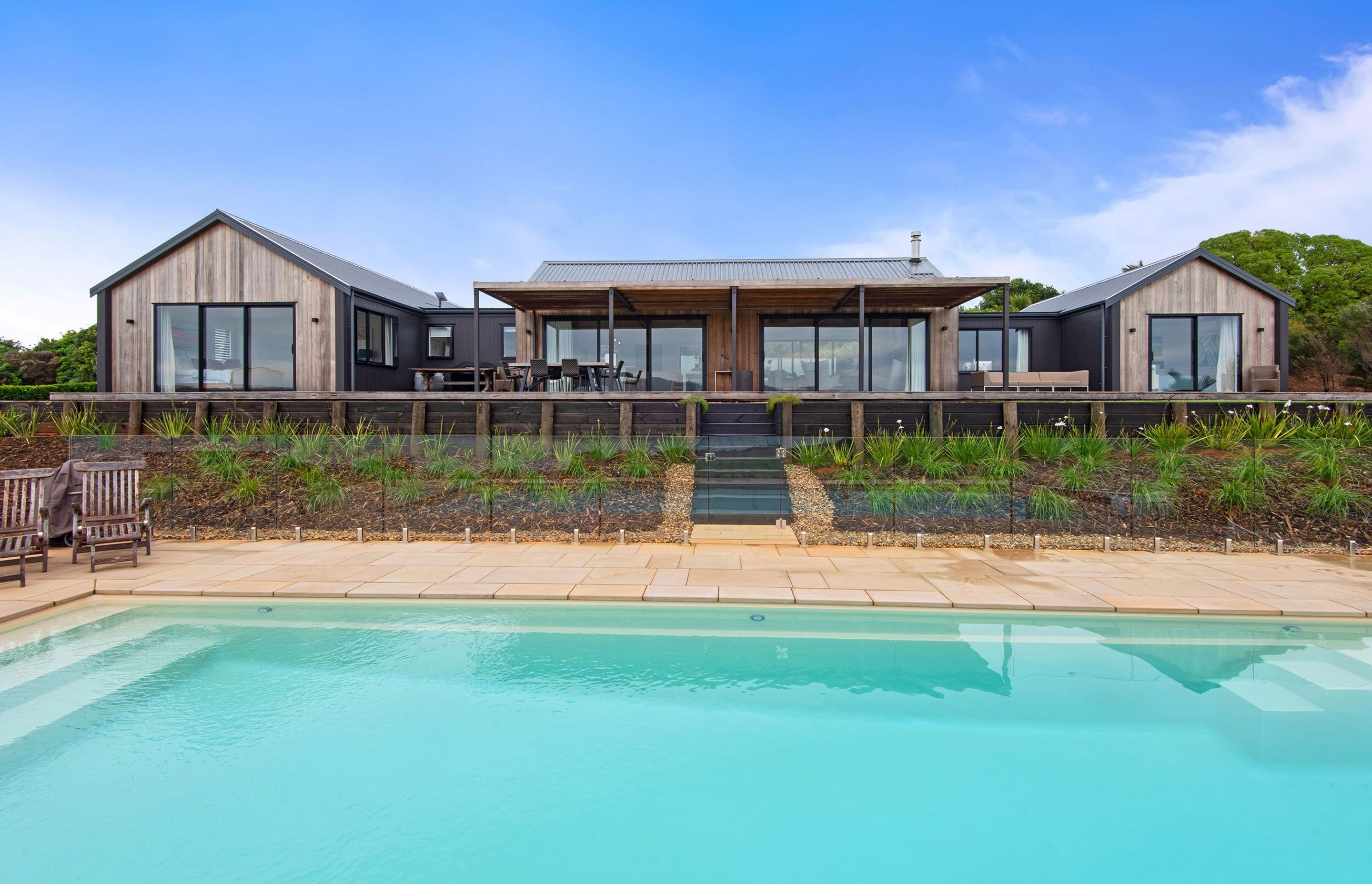 The white swimming pool turns a surprisingly vibrant turquoise when full.