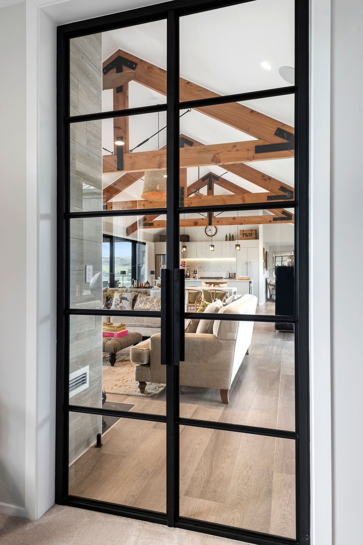 The Crittall door is a stand-out feature in the home, allowing line of sight whilst separating the bedrooms from the living area.