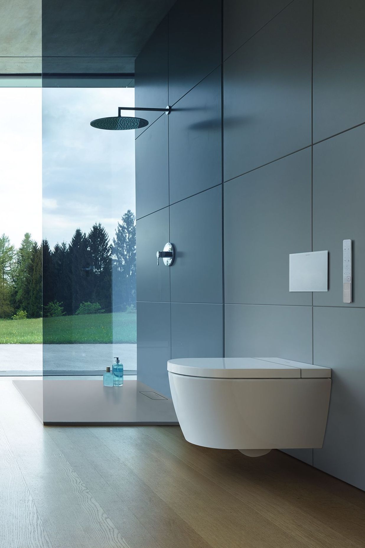 A minimalist shower and smart toilet are the perfect combo in this sleek bathroom.