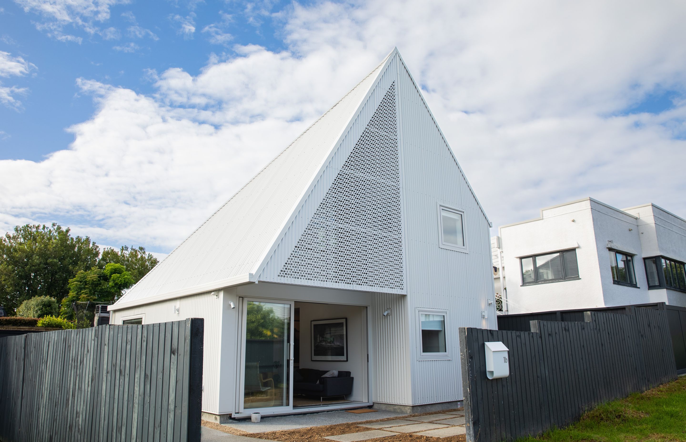 The Paper House was created to resemble folded paper and makes the most of a very compact site.