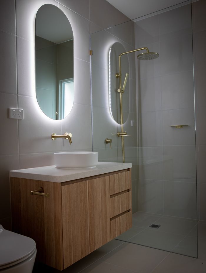 LED lights add ambience and atmosphere. Featured project: American Oak Vanities