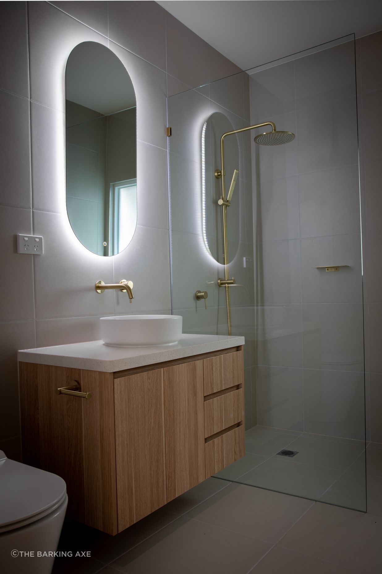 LED lights add ambience and atmosphere. Featured project: American Oak Vanities