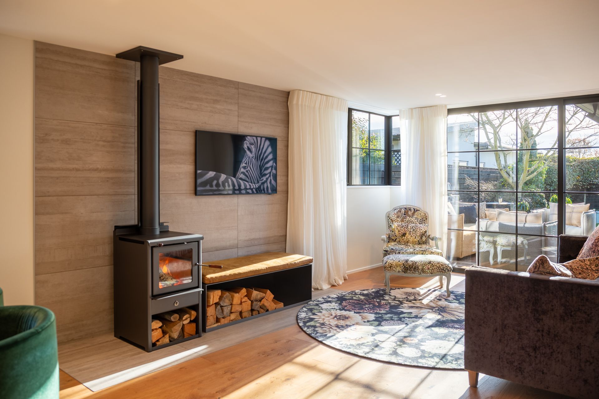 This stunning wood fire from Simply Heat brings natural radiant warmth to this light-filled open plan space.