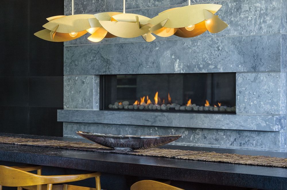 With the textured steel intersecting with the lights the Koi Collections creates a drama of light and shadow