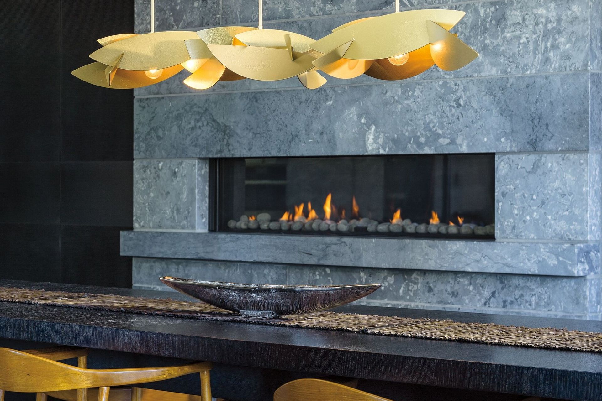 With the textured steel intersecting with the lights the Koi Collections creates a drama of light and shadow