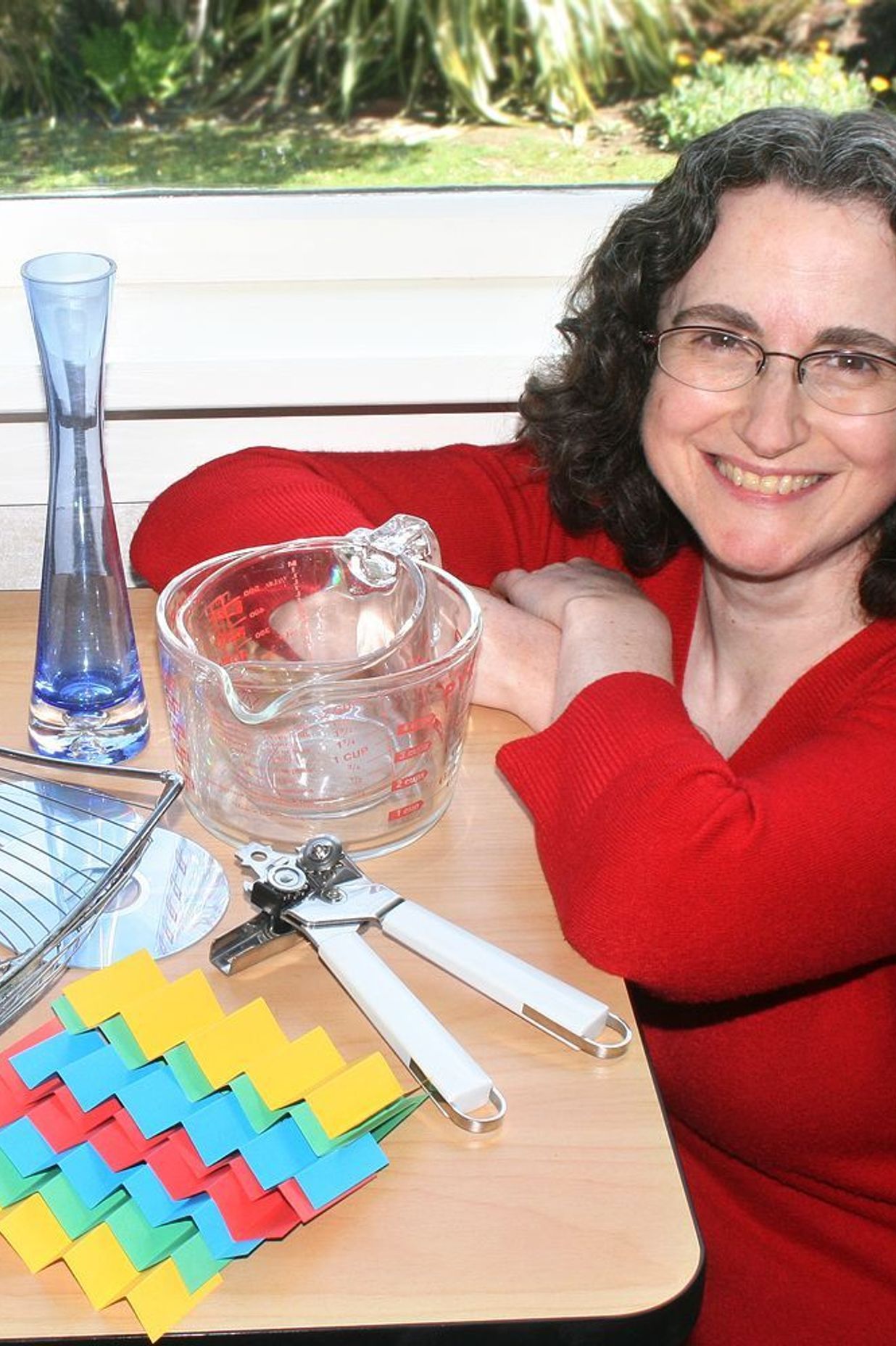  Jane with a selection of household items she’s used as subject matter for her photography