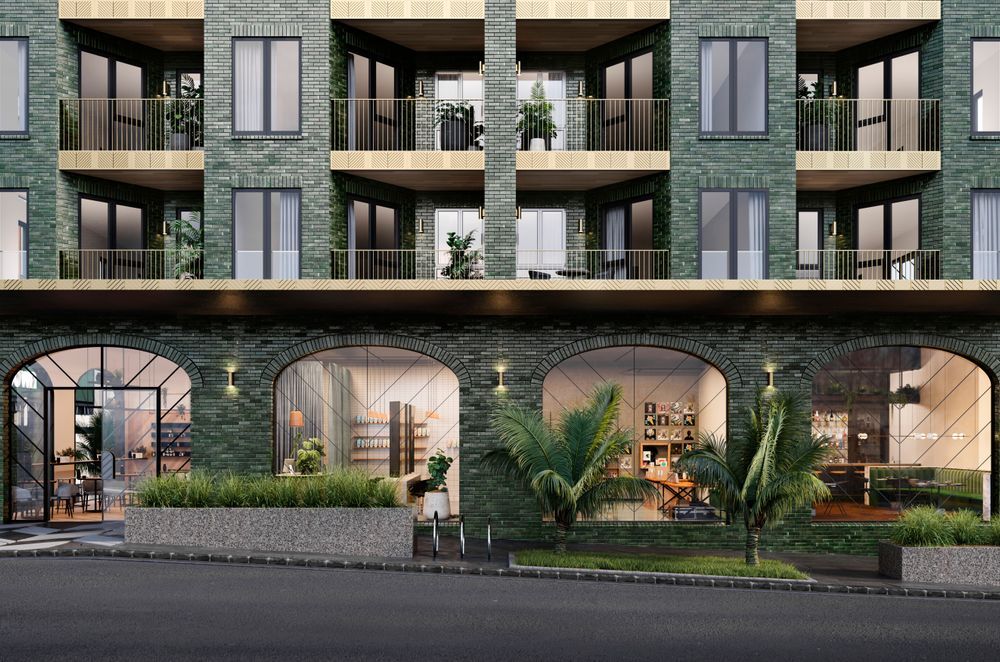 The feather motif can be seen on the windows of the ground floor commercial space.